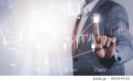 Oil energy graph of the world market, impact on the economy concept, Businessman touch chart with the indicator on the oil price slide at gas station, fluctuations in oil prices and exchange trade. Oil energy graph of the world market, impact on the economy concept, Businessman touch chart with the indicator on the oil price slide at gas station, fluctuations in oil prices and exchange trade. 90344430