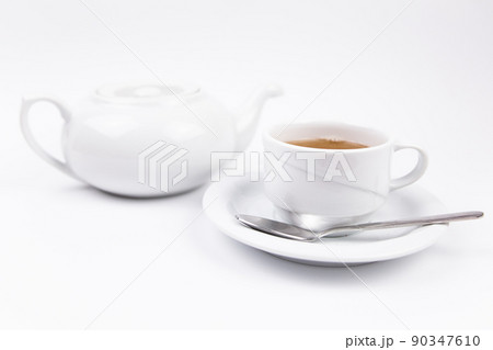 a white tea set with teapot tea and saucers and pie for breakfast a white tea set with teapot tea and saucers and pie for breakfast 90347610