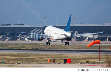 passenger plane lands at airport passenger plane lands at airport 90347754