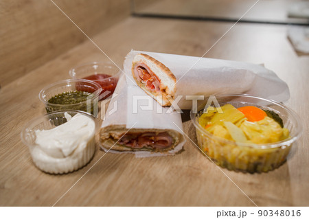 ham sandwich a appetizer with sauce on the table 90348016