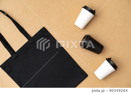 Textile shopping bag and coffee cup flat lay 90349264