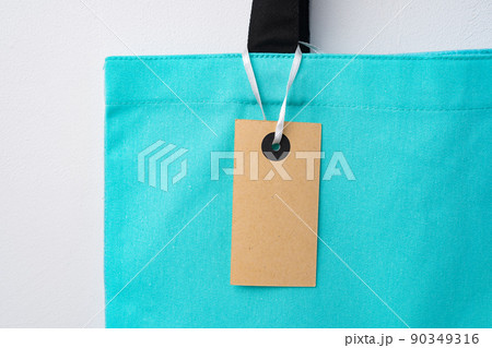 Eco bag for shopping with blank tag on white background Eco bag for shopping with blank tag on white background 90349316