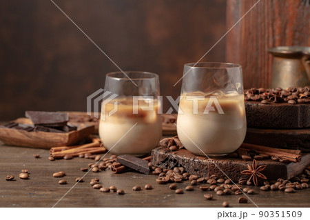 Cream and coffee cocktail in glasses with ice. Cream and coffee cocktail in glasses with ice. 90351509