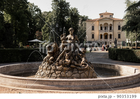 beautiful statue fountain on the territory of the chateau in italy 90353199