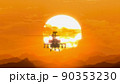 Helicopter flying over the mountains at sunset, hot weather, heat distortion 90353230