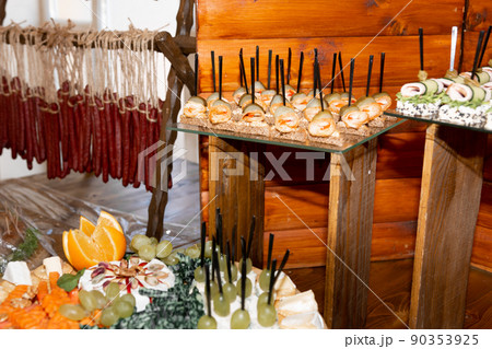 Snacks with sausage, cheese, lard and various sauces at a Ukrainian wedding. Snacks with sausage, cheese, lard and various sauces at a Ukrainian wedding. 90353925
