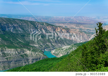 mountain landscape in the Caucasus with a view of the valley of the Sulak River, the Miatli hydroelectric power station and the towns of New Zubutli and Kizilyurt in the distance 90353989