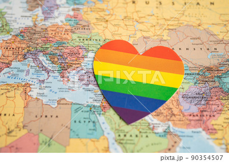 Bangkok, Thailand, June 1, 2022 Rainbow color heart on globe world map background, LGBT pride month celebrate annual in June, symbol of gay, lesbian, bisexual, transgender, human rights and peace. Bangkok, Thailand, June 1, 2022 Rainbow color heart on globe world map background, LGBT pride month celebrate annual in June, symbol of gay, lesbian, bisexual, transgender, human rights and peace. 90354507