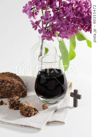The Feast of Corpus Christi Concept. Bread and red wine symbols of Jesus Christ blood and body. The Feast of Corpus Christi Concept. Bread and red wine symbols of Jesus Christ blood and body. 90355472