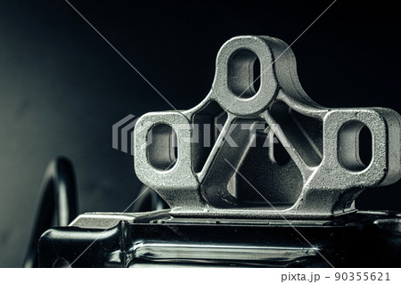 Metal car engine spare part on black background 90355621