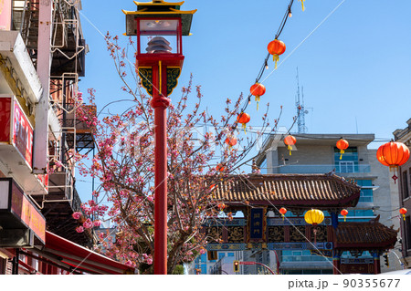 Victoria, BC, Canada - April 14 2021 : Victoria Chinatown, with the Gate of Harmonious Interest in the background. The oldest Chinatown in Canada and the second oldest in North America. Victoria, BC, Canada - April 14 2021 : Victoria Chinatown, with the Gate of Harmonious Interest in the background. The oldest Chinatown in Canada and the second oldest in North America. 90355677