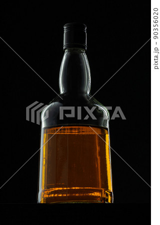 Bottle of whisky on black background, copy space 90356020