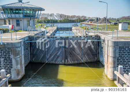 Den Helder, Netherlands, May 2022. Locks and mooring posts at Oostoever in Den Helder. Den Helder, Netherlands, May 2022. Locks and mooring posts at Oostoever in Den Helder. 90356163
