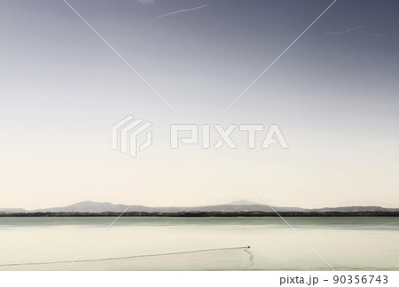 Calm waters and sail boat 90356743