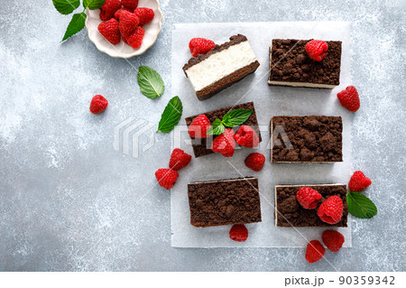 Chocolate cube cake, sliced brownie cheesecake with fresh raspberry 90359342