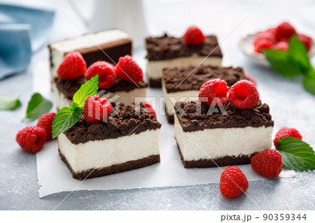 Chocolate cube cake, sliced brownie cheesecake with fresh raspberry 90359344