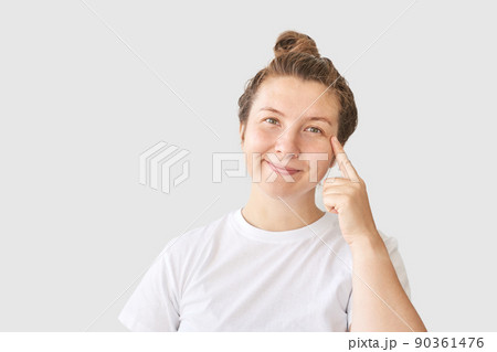 Young woman posing at grey background. Home vacation portrait Young woman posing at grey background. Home vacation portrait 90361476