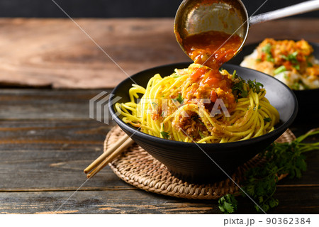 Noodle mixed with spicy tomatoes sauce, Tai Yai food in Northern of Thailand Noodle mixed with spicy tomatoes sauce, Tai Yai food in Northern of Thailand 90362384