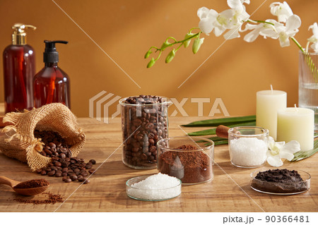 Close view of coffee and salt decorated with coffee pack and flower towel in wooden background for advertising Close view of coffee and salt decorated with coffee pack and flower towel in wooden background for advertising 90366481