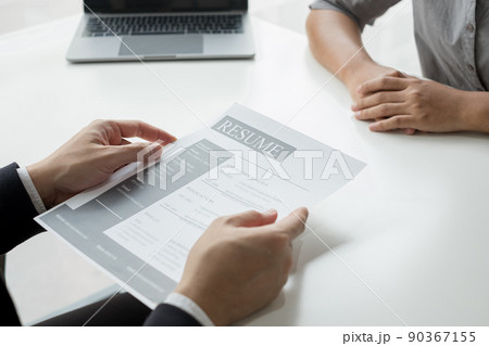 Business people hold a resume and talk to job applicants for job interviews about careers and Their personal history in the company. Recruitment concepts 90367155