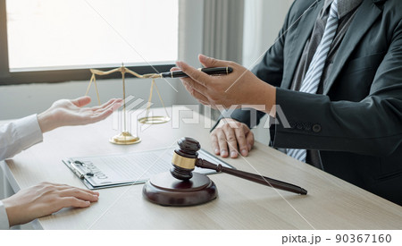 A man lawyer or a judge counseling clients about judicial justice and prosecution with scales, judges gavel, legal documents legal services concept A man lawyer or a judge counseling clients about judicial justice and prosecution with scales, judges gavel, legal documents legal services concept 90367160