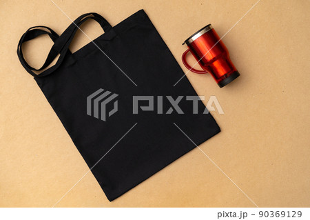 Textile shopping bag and coffee cup flat lay 90369129