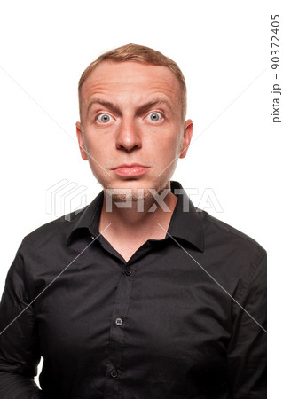 Handsome young blond man in a black shirt, isolated on a white background 90372405