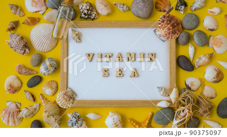 Composition sheet white paper text VITAMIN SEA, seashells, pebbles, mockup on yellow background. Blank, top view, still life, flat lay. sea vacation travel concept tourism and resorts. Composition sheet white paper text VITAMIN SEA, seashells, pebbles, mockup on yellow background. Blank, top view, still life, flat lay. sea vacation travel concept tourism and resorts. 90375097