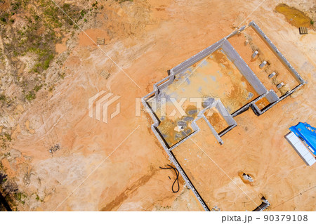 Cement foundation of house in construction site on land from concrete blocks Cement foundation of house in construction site on land from concrete blocks 90379108