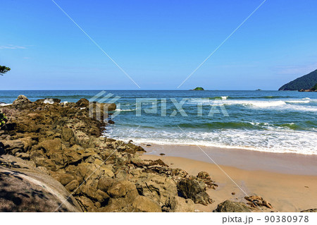 Paradisiacal rocky beach with clean and calm waters 90380978