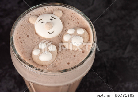 cocoa drink decorated with funny cookies on a dark background cocoa drink decorated with funny cookies on a dark background 90381285