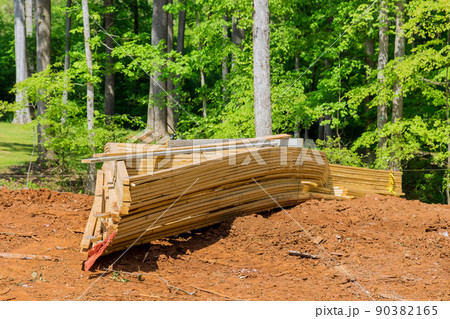 Framing of under construction wooden house building frame structure on new development 90382165