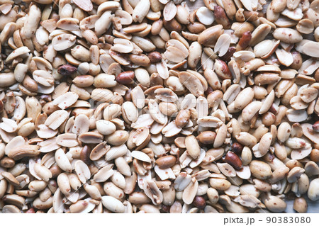 Processed pea nuts in a bowl on table top down . Processed pea nuts in a bowl on table top down . 90383080