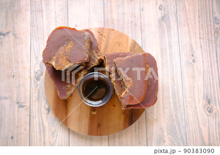 top view of stack of Jaggery traditional cane sugar cube on table top view of stack of Jaggery traditional cane sugar cube on table 90383090