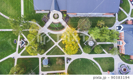 Aerial of landscaping and sidewalks through campus in midwest America 90383194