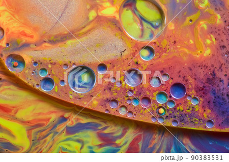Sparkling liquid surface of rainbow colors and cool colored spheres 90383531