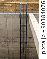 The steel stair on the concrete wall of the well 90384076