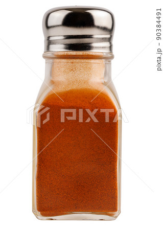 glass pepper pot with ground red paprika pepper isolated on white background 90384491