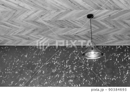 Pendant lamp in glass frame light on the ceiling in modern interior design with plastered grey wall background 90384693