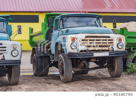 Freight trucks stand by the market storage. 90386790