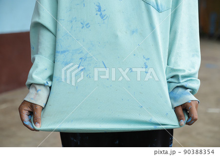dirty color stain on clothes from painting in daily life. dirty stain for cleaning work idea. 90388354