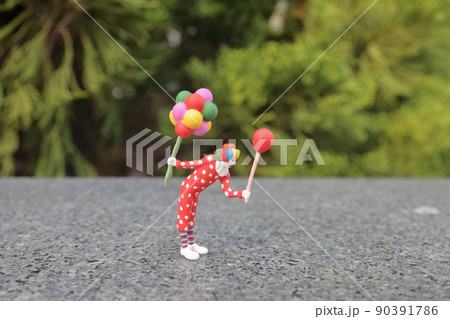 a fun of figure colorful clown with balloons 90391786