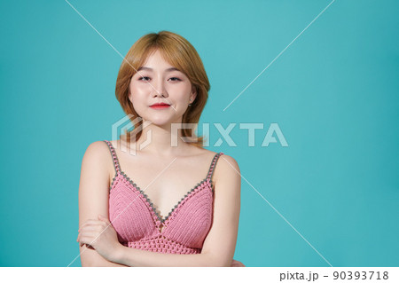 Young beautiful smiling female in trendy summer shorts Young beautiful smiling female in trendy summer shorts 90393718