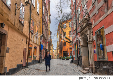 Stockholm Sweden, city skyline at Gamla Stan old town with woman tourist Stockholm Sweden, city skyline at Gamla Stan old town with woman tourist 90395913
