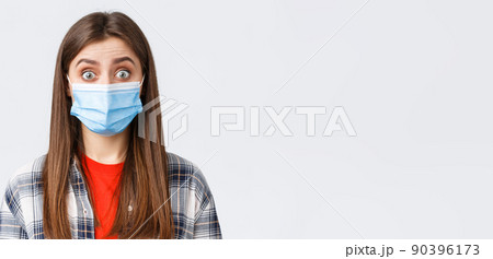 Coronavirus outbreak, leisure on quarantine, social distancing and emotions concept. Close-up of intrigued, surprised woman hear interesting news, wear medical mask, widen eyes Coronavirus outbreak, leisure on quarantine, social distancing and emotions concept. Close-up of intrigued, surprised woman hear interesting news, wear medical mask, widen eyes 90396173