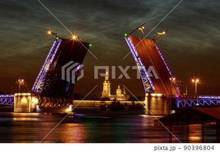 Raised Palace bridge over river Neva. Raising of bridges in Saint-Petersburg, Russia. Summer white night. 90396804