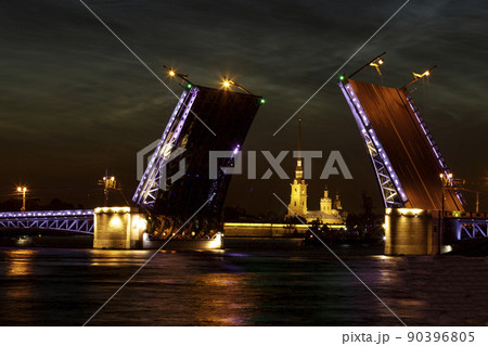 Raised Palace bridge over river Neva. Raising of bridges in Saint-Petersburg, Russia. Summer white night. 90396805