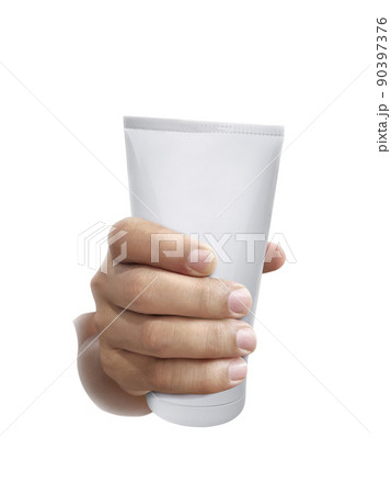 Human hand holding Cosmetic plastic tube isolated on white background Human hand holding Cosmetic plastic tube isolated on white background 90397376