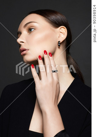 Beautiful young woman with jewelry 90398914