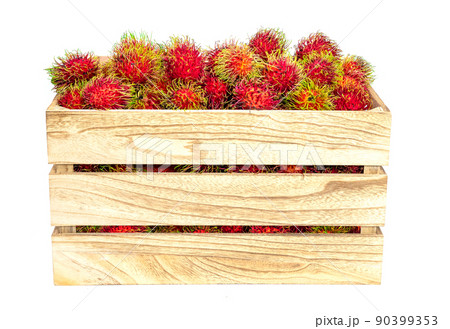 rambutan fruit in wooden crate..on a white background rambutan fruit in wooden crate..on a white background 90399353